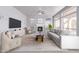 Staged living room featuring modern furniture, fireplace, and plenty of natural light at 8219 E Tesoro Cir, Mesa, AZ 85207