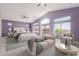 Spacious main bedroom featuring vaulted ceilings, sitting area, and large windows at 8219 E Tesoro Cir, Mesa, AZ 85207