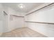 Walk-in closet with ample storage space, featuring multiple rods and shelves for organized clothing and accessories at 8219 E Tesoro Cir, Mesa, AZ 85207