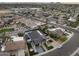 Aerial view of the property featuring a solar panel system, desert landscaping, and a private pool at 8409 E Clarendon Ave, Scottsdale, AZ 85251
