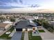 An aerial perspective showcasing a solar-paneled roof, stylish landscaping, and convenient access at 8409 E Clarendon Ave, Scottsdale, AZ 85251