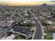 Neighborhood aerial showcasing the property's prime location and mountain views in the distance at 8409 E Clarendon Ave, Scottsdale, AZ 85251