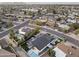 Expansive aerial view showcases a neighborhood with lush landscaping, pools, and mountain views, highlighting a desirable community at 8409 E Clarendon Ave, Scottsdale, AZ 85251