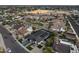 This aerial view highlights a pool, solar panels, modern landscaping, and a convenient location at 8409 E Clarendon Ave, Scottsdale, AZ 85251