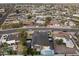 The home features solar panels, modern landscaping, a pool, and easy access to a neighborhood street at 8409 E Clarendon Ave, Scottsdale, AZ 85251