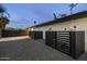 Gated backyard features a gravel patio, offering a private outdoor space at 8409 E Clarendon Ave, Scottsdale, AZ 85251