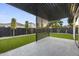Backyard features a modern pergola, artificial turf and desert landscaping at 8409 E Clarendon Ave, Scottsdale, AZ 85251