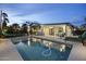 A refreshing backyard pool with lounge area offers an ideal outdoor living experience at 8409 E Clarendon Ave, Scottsdale, AZ 85251