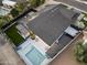 Aerial view of a private backyard featuring a sparkling pool, well-manicured lawn, and modern patio perfect for outdoor living at 8409 E Clarendon Ave, Scottsdale, AZ 85251