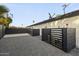 Gated backyard features a gravel patio, offering a private outdoor space at 8409 E Clarendon Ave, Scottsdale, AZ 85251