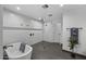 Elegant bathroom with standalone tub, glass shower, and tile accents at 8409 E Clarendon Ave, Scottsdale, AZ 85251