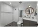 Bathroom featuring subway tile shower, modern toilet and sink with custom mirror at 8409 E Clarendon Ave, Scottsdale, AZ 85251