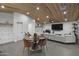 Modern, open concept dining and living space with clean, modern style and unique ceiling design at 8409 E Clarendon Ave, Scottsdale, AZ 85251