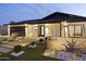 Inviting modern home with desert landscaping and a unique block wall address marker at 8409 E Clarendon Ave, Scottsdale, AZ 85251