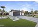 Inviting home featuring modern landscaping, xeriscaping, and a well-maintained exterior at 8409 E Clarendon Ave, Scottsdale, AZ 85251
