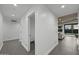 Bright hallway featuring neutral colors, recessed lighting, and gray tile flooring at 8409 E Clarendon Ave, Scottsdale, AZ 85251