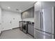 Functional laundry room with modern washer, dryer, and ample storage at 8409 E Clarendon Ave, Scottsdale, AZ 85251