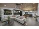 Open concept living room featuring an eat in kitchen, with modern furnishings and accents at 8409 E Clarendon Ave, Scottsdale, AZ 85251