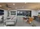 Open-concept living room with modern furniture and outdoor views at 8409 E Clarendon Ave, Scottsdale, AZ 85251