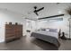 Main bedroom featuring modern finishes with a sliding barn door and recessed lighting at 8409 E Clarendon Ave, Scottsdale, AZ 85251