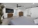 Main bedroom featuring modern finishes and access to an en suite bathroom at 8409 E Clarendon Ave, Scottsdale, AZ 85251