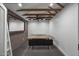 Bright office space featuring exposed beams, a ceiling fan, and minimalist decor for a modern workspace at 8409 E Clarendon Ave, Scottsdale, AZ 85251