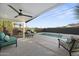 Outdoor patio with a lounge area overlooking the pool, creating a relaxing atmosphere at 8409 E Clarendon Ave, Scottsdale, AZ 85251