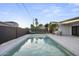 Backyard oasis: Beautiful pool with ample patio space, perfect for outdoor relaxation at 8409 E Clarendon Ave, Scottsdale, AZ 85251