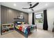 Stylish bedroom with Marvel theme, featuring a playful bed and a modern bookshelf at 9331 S Lakeshore Dr, Tempe, AZ 85284