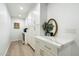 Bright hallway with ample white cabinets, countertop space, and modern lighting at 9331 S Lakeshore Dr, Tempe, AZ 85284