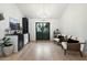 Bright living area featuring light wood flooring, white walls, stylish furniture, and modern decor with a chandelier at 9331 S Lakeshore Dr, Tempe, AZ 85284