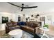 Open-concept living room and kitchen with stylish decor, comfortable seating, and light wood flooring at 9331 S Lakeshore Dr, Tempe, AZ 85284