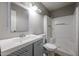 Well-lit bathroom with sleek vanity and shower, accented by neutral walls and white fixtures at 10411 N 11Th Ave # 28, Phoenix, AZ 85021