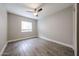 Bright bedroom with tile flooring, ceiling fan, and a window offering natural light at 10411 N 11Th Ave # 28, Phoenix, AZ 85021