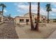 Charming exterior featuring desert landscaping, red brick accents, and privacy fencing, all under a bright sky at 10411 N 11Th Ave # 28, Phoenix, AZ 85021