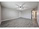 Bright living room with tile floors, a ceiling fan, and neutral color scheme at 10411 N 11Th Ave # 28, Phoenix, AZ 85021