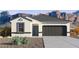 Charming single-story home with a neutral color scheme, two-car garage, and desert landscaping at 10616 W Sonrisas St, Tolleson, AZ 85353