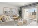 Cozy living room with neutral tones, comfortable seating, and natural light creating a welcoming atmosphere at 10616 W Sonrisas St, Tolleson, AZ 85353