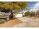 Charming single-story home with a two-car garage, xeriscaped front yard, and stone accents at 10656 E Plata Ave, Mesa, AZ 85212