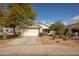 Charming single-story home with a two-car garage, xeriscaped front yard, and stone accents at 10656 E Plata Ave, Mesa, AZ 85212