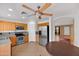 Traditional kitchen features stainless steel appliances, tile flooring and light wood cabinets at 10656 E Plata Ave, Mesa, AZ 85212