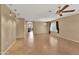 Spacious living room with tile flooring, a ceiling fan, and neutral paint at 10656 E Plata Ave, Mesa, AZ 85212