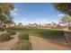 Community playground with mature trees and grassy area in a well maintained neighborhood at 10656 E Plata Ave, Mesa, AZ 85212