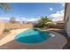 Backyard pool features mature landscaping and blue skies at 10656 E Plata Ave, Mesa, AZ 85212