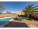 Relaxing poolside area with a table and chairs at 10656 E Plata Ave, Mesa, AZ 85212