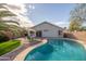 Backyard pool with patio and palm trees at 10656 E Plata Ave, Mesa, AZ 85212