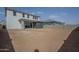 Large backyard, perfect for customization, with a view of the home's rear elevation at 11051 E Ulysses Ave, Mesa, AZ 85212