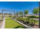 Bocce ball court with pergola and seating. String lights give an enchanting feel at 11051 E Ulysses Ave, Mesa, AZ 85212