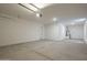 Spacious and well-lit garage with ample room for storage and parking featuring a water heater at 11051 E Ulysses Ave, Mesa, AZ 85212