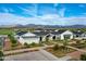 Exterior view of a clubhouse with well-maintained landscaping, set against a backdrop of distant mountains at 11300 N Casa Dega Dr # 1058, Surprise, AZ 85388